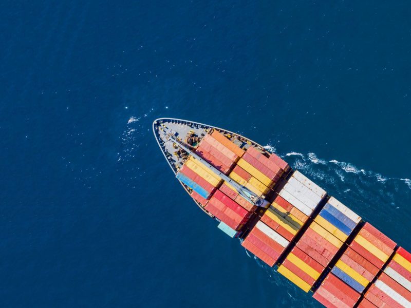cargo-ship-full-loaded-with-containers-blue-sea-ba